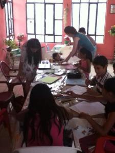 The children enjoyed chatting while making abstract art.