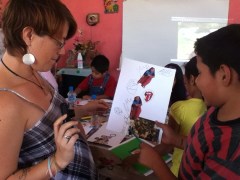 Katie studies Manuel's surrealist collage