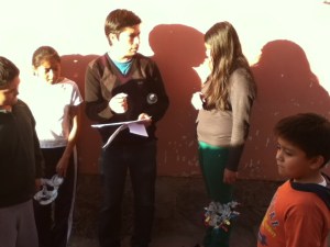 TAN artist consulting with children